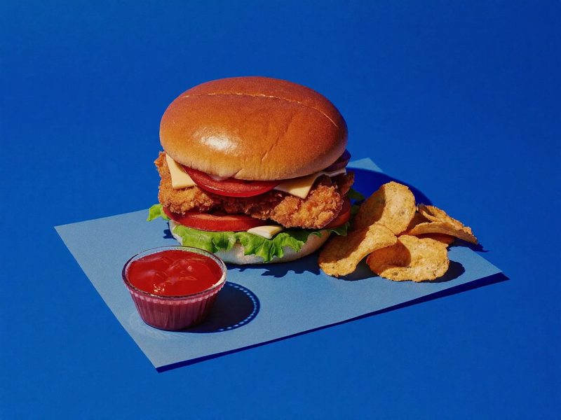 A chicken burger and a beef burger side by side
