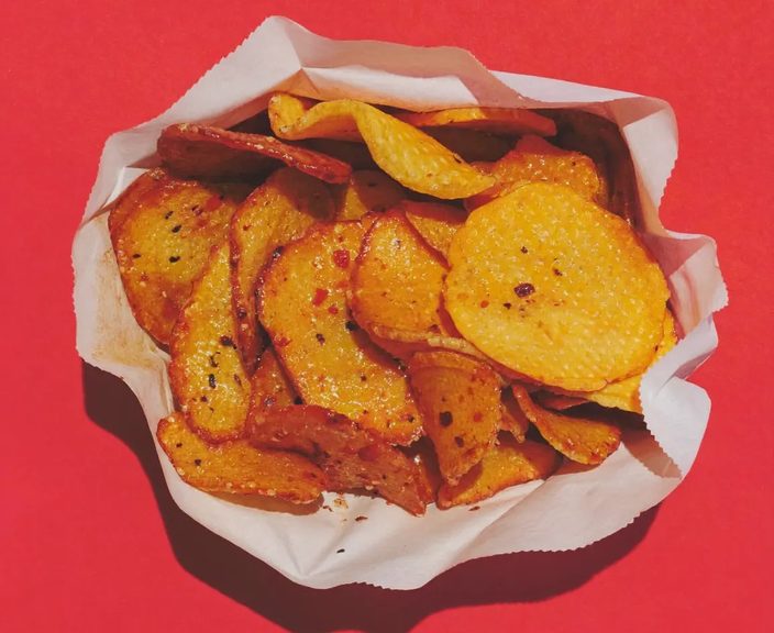 Thick-cut seasoned chips in paper