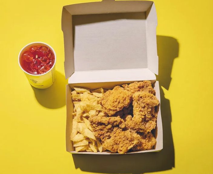 A meal box of fried chicken and chips