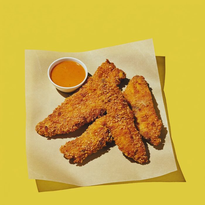 A portion of fried chicken wings in a carton